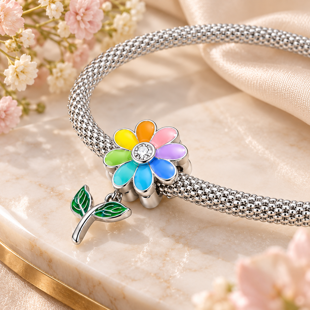 Close up view of colorful sunflower charm and beaded details on sterling silver bracelet