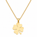 Gold tone four leaf clover pendant necklace with stainless steel chain on white background
