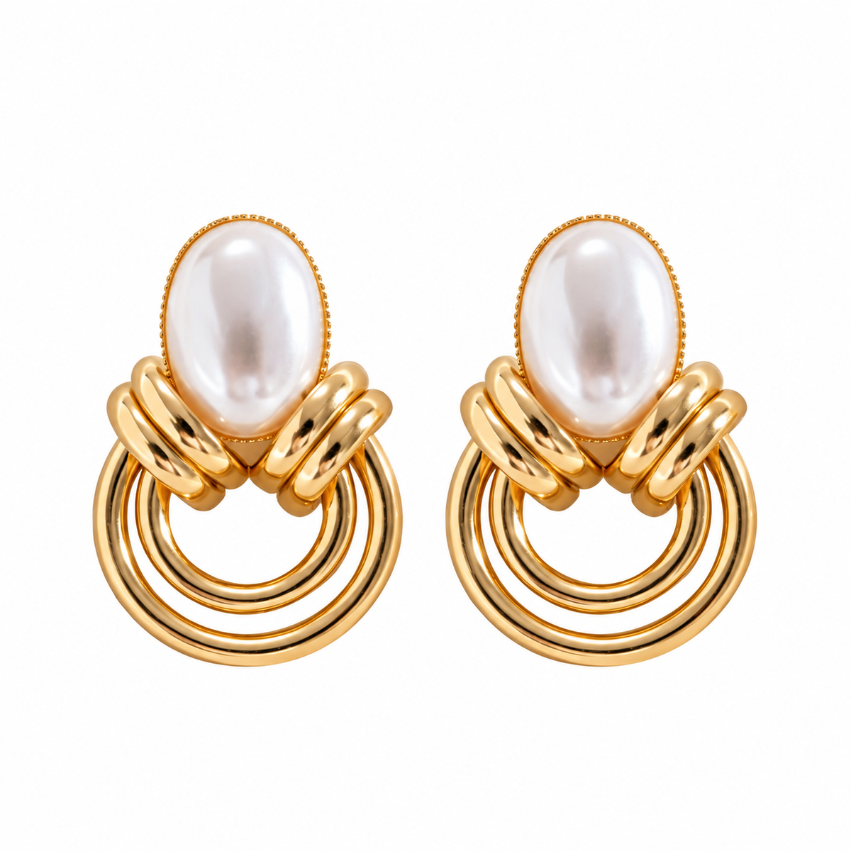 Gold-tone pearl drop earrings with double hoop design on a white background
