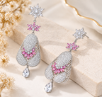 Long dangle rhinestone earrings featuring pink crystal accents and silver-tone fashion design
