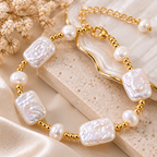 Close up view of vintage pearl bracelet showing pearl texture and gold tone chain details