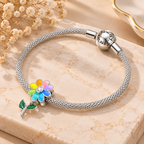 Sunflower charm sterling silver bracelet displayed from angle view with colorful floral details