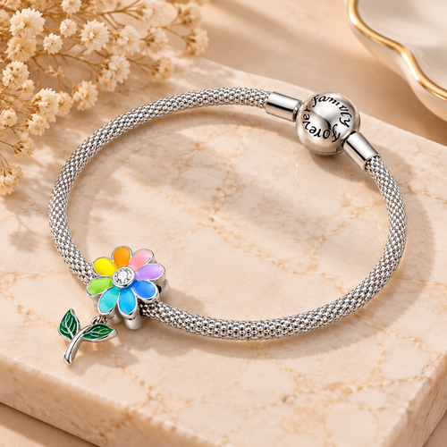 Sunflower charm sterling silver bracelet displayed from angle view with colorful floral details