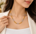 Woman wearing two tone stainless steel chain necklace with gold and silver fashion jewelry style