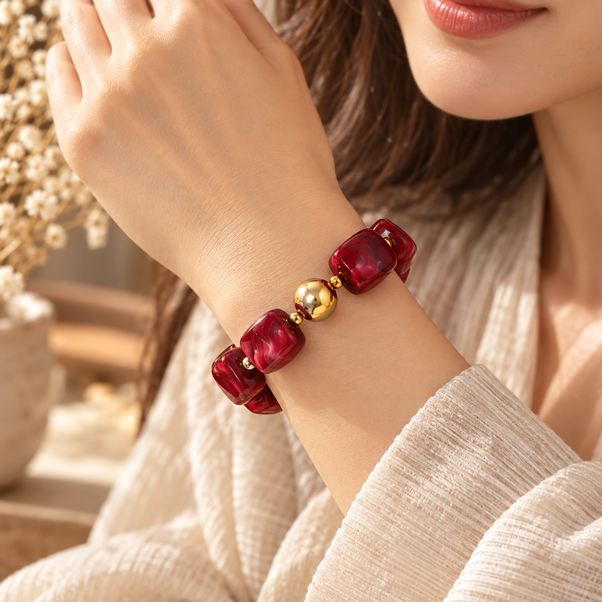Woman wearing geometric beaded bracelet with modern fashion jewelry style