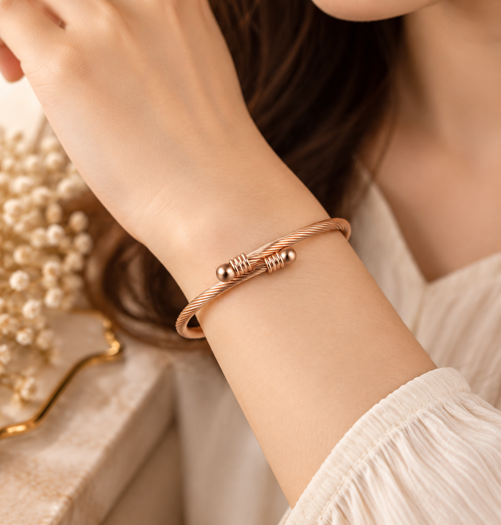 Woman wearing rose gold titanium steel cuff bracelet with minimalist fashion style